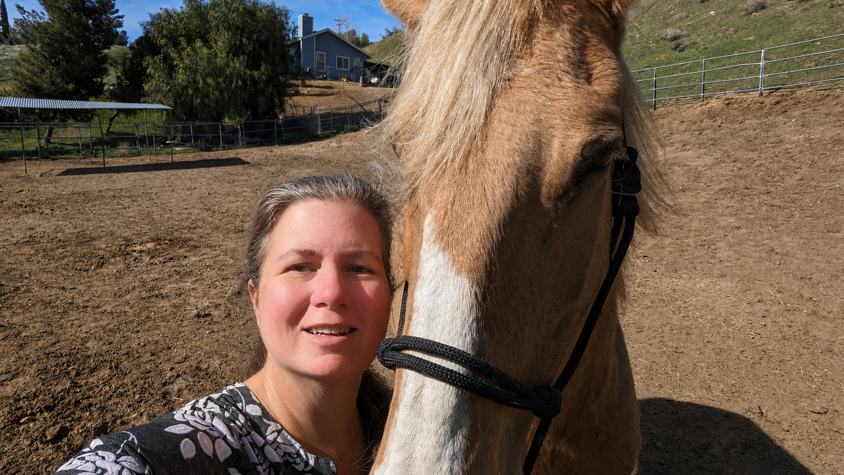 April Lee, founder of Traders Till, with her palomino horse Malibu